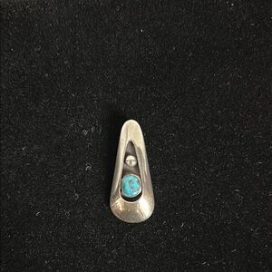Native American sterling silver/turquoise pendant.